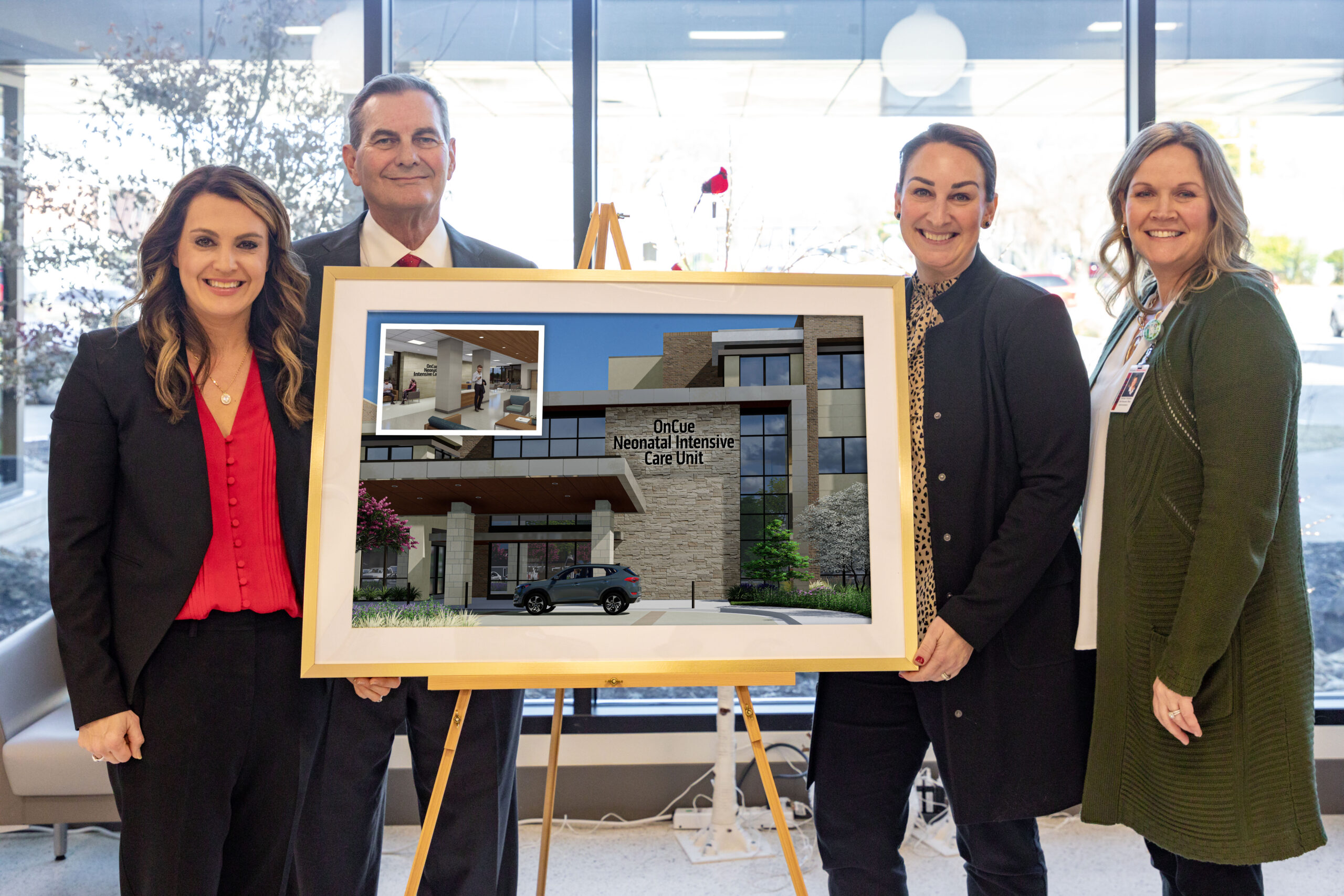 Laura Aufleger, President of OnCue and Jim Griffith OnCue CEO stand with Stillwater Hospital leadership with rendering of OnCue Neonatal Intensive Care Unit