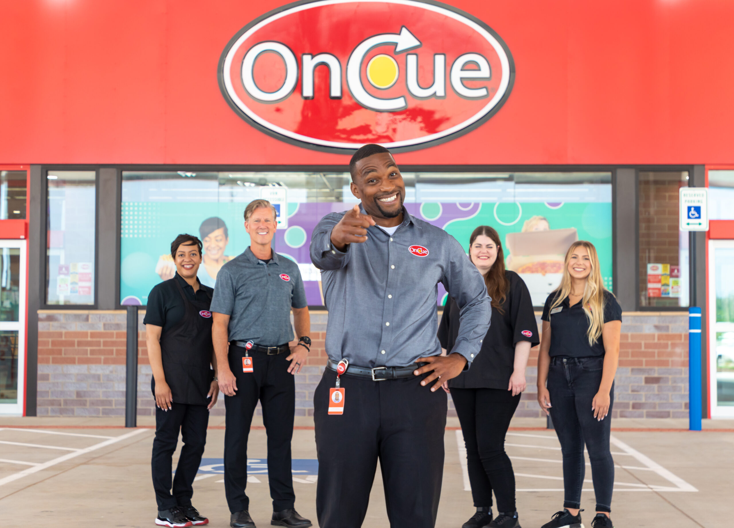 OnCue team member pose for recruitment images as they share their experiences with the company.