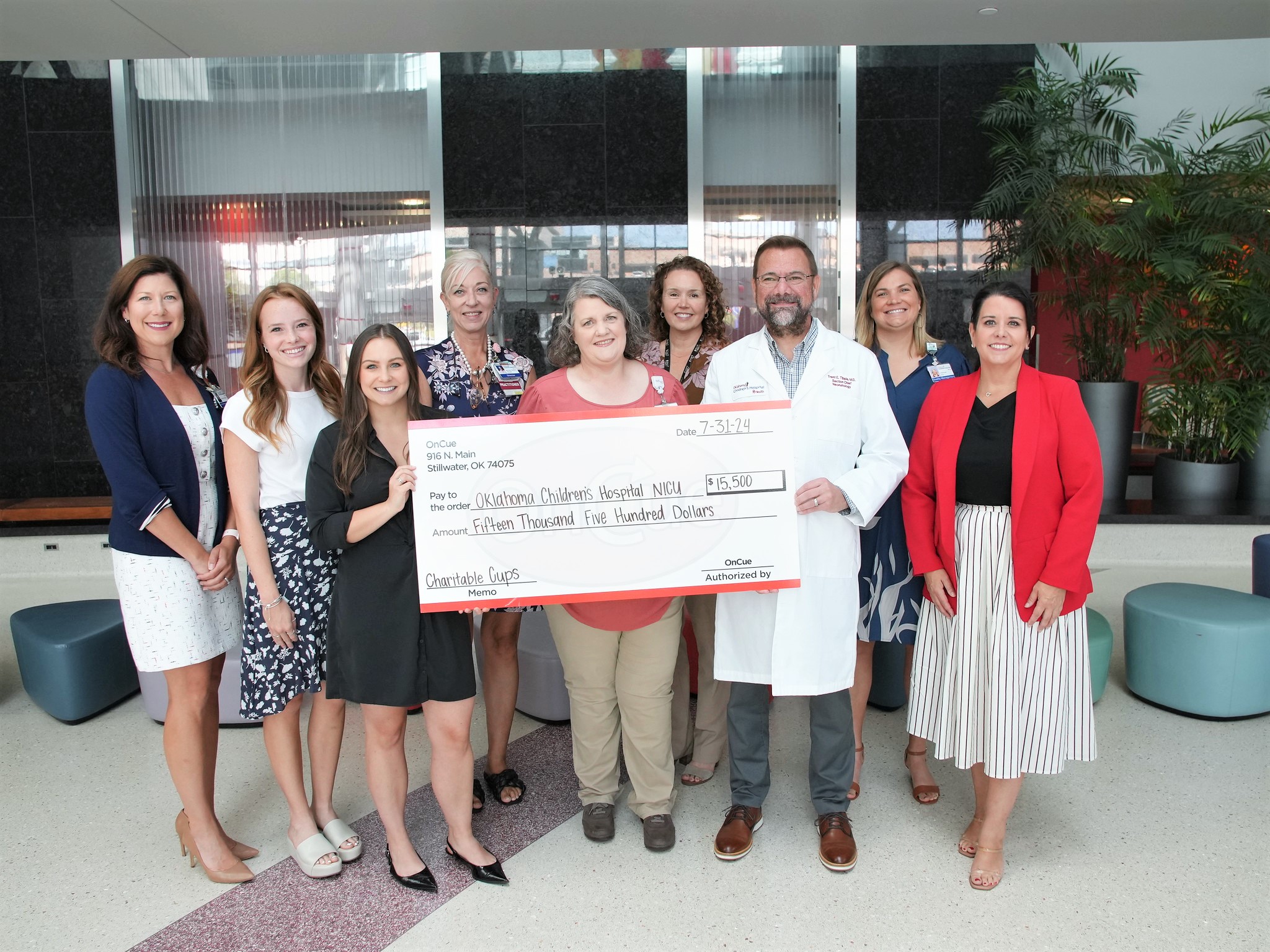 OnCue presents $15,500 jumbo check to the team at Oklahoma Children's Hospital.