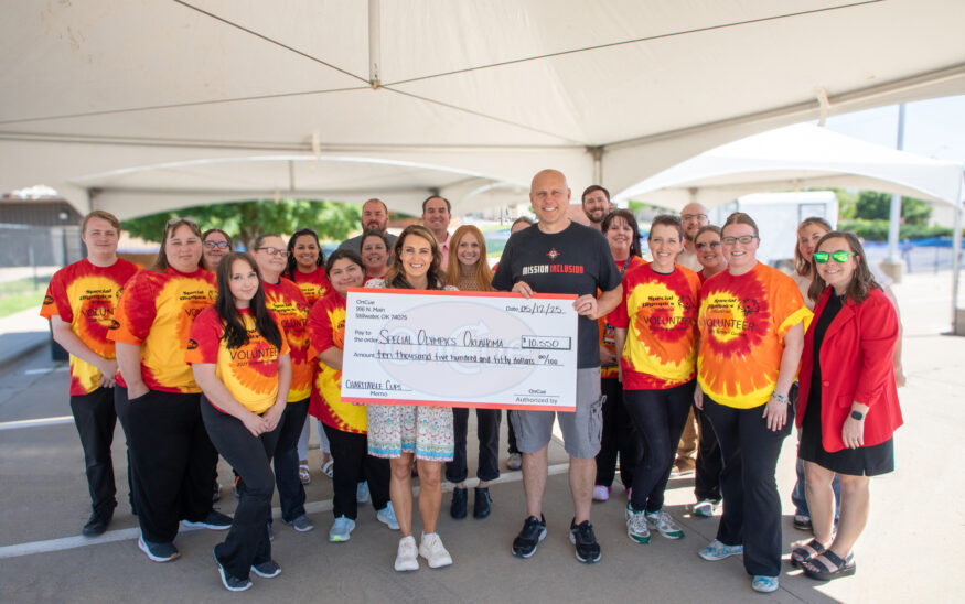 OnCue President, Laura Aufleger, and OnCue team members, presenting a check to Derek Cain, COO of Special Olympics Oklahoma at the SOOK Summer Games in Stillwater, OK, Monday, May 12, 2025. (Photo/Emilee Barbour)