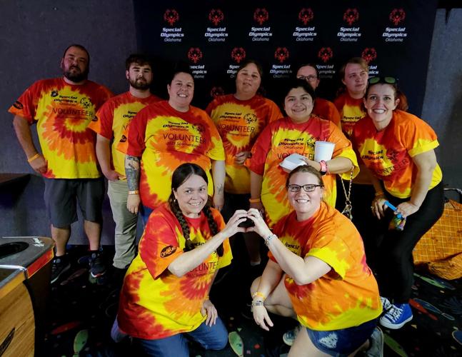 OnCue managers volunteer for the bowling event Wednesday during Special Olympics Oklahoma Summer Games at Frontier Lanes